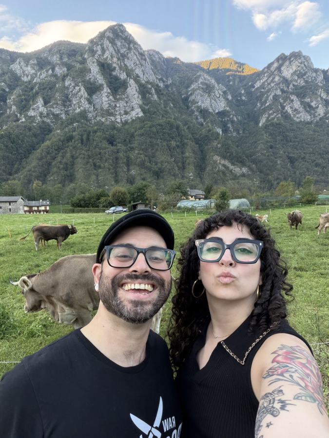 Emilia and Tommy taking a selfie in an alpine pasture