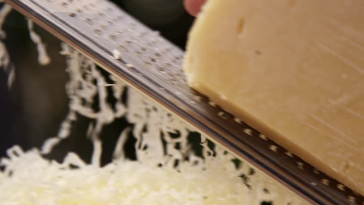 Cheese being grated